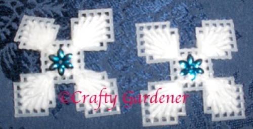 snowflakes made with plastic canvas and yarn at craftygardener.ca