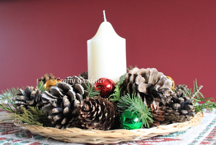 make a pinecone and candle centre piece for the holiday table at craftygardener.ca