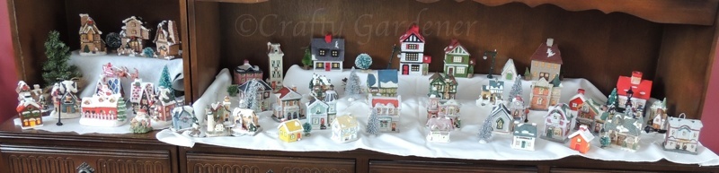 the Christmas village on the china hutch at craftygardener.ca