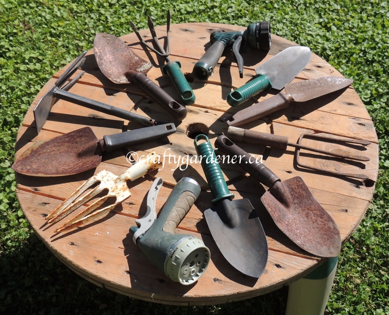 old garden tools fastened onto a round piece of wood ... craftygardener.ca
