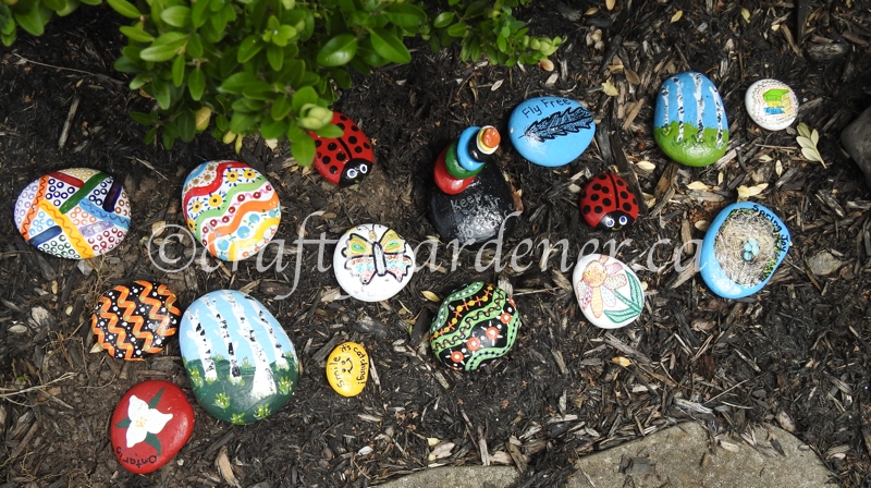 painted rocks in the garden at craftygardener.ca